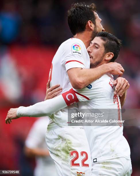 Franco Vazquez of Sevilla CF celebrates with his teammates Sergio Escudero of Sevilla CF after scoring his team's second goal during the La Liga...