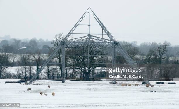 Snow surrounds the skeleton structure of the Pyramid Stage at the site of the Glastonbury Festival site at Worthy Farm in Pilton near Glastonbury on...