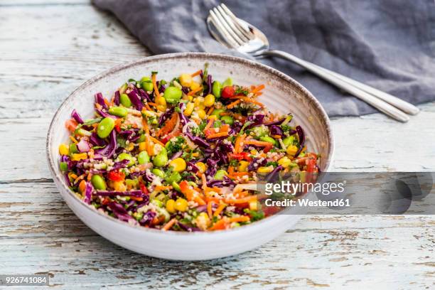 quinoa salad with edamame, corn, carott, tomato, paprika, onions in a bowl - quinoa meal stock pictures, royalty-free photos & images