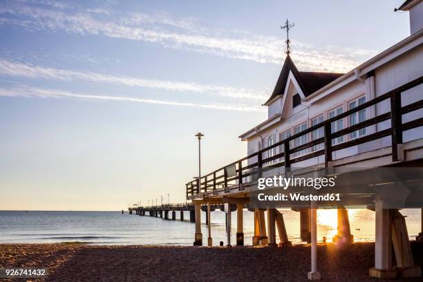 germany, mecklenburg-western pomerania, usedom, ahlbeck, sea bridge at sunset - ahlbeck stock pictures, royalty-free photos & images