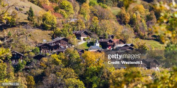 switzerland, valais, tschingeren, houses in mountain village - wallis stockfoto's en -beelden