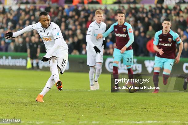 Jordan Ayew of Swansea City scores with a penalty during the Premier League match between Swansea City and West Ham United at The Liberty Stadium on...