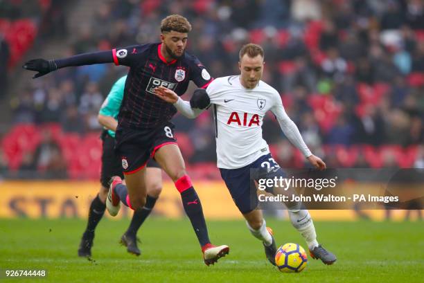Huddersfield Town's Philip Billing and Tottenham Hotspur's Christian Eriksen battle for the ball during the Premier League match at Wembley Stadium,...