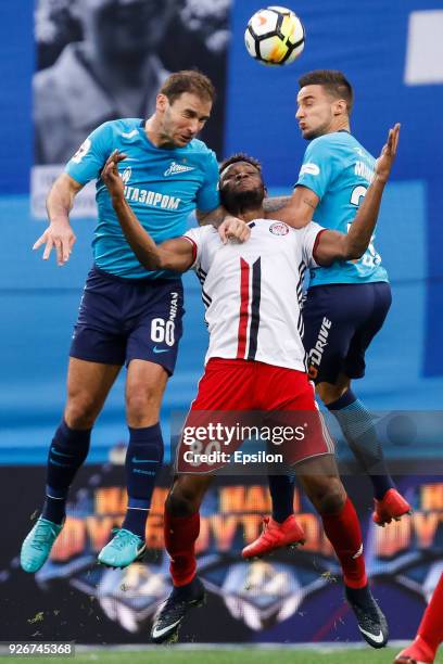 Branislav Ivanovic and Emanuel Mammana of FC Zenit Saint Petersburg vie for the ball with Aaron Olanare of FC Amkar Perm during the Russian Football...