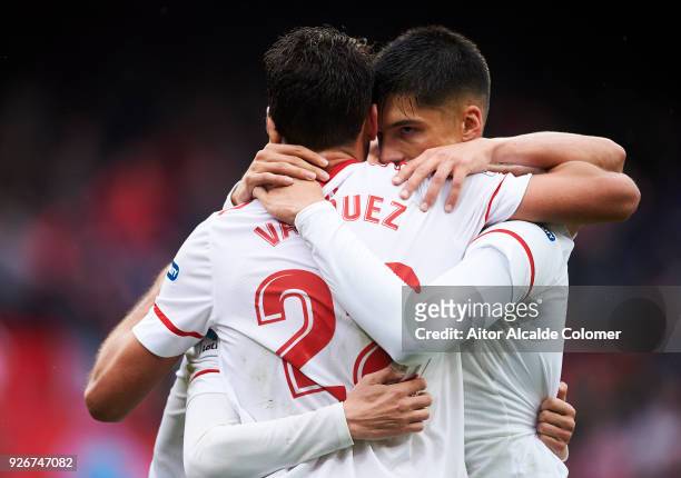 Franco Vazquez of Sevilla CF celebrates with his teammates Sergio Escudero and Joaquin Correa of Sevilla CF after scoring his team's second goal...