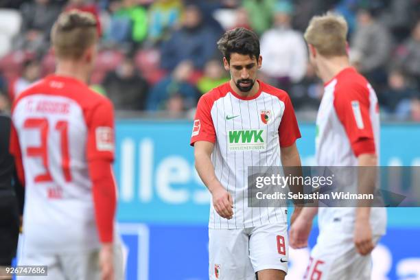 Rani Khedira of Augsburg looks down during the Bundesliga match between FC Augsburg and TSG 1899 Hoffenheim at WWK-Arena on March 3, 2018 in...