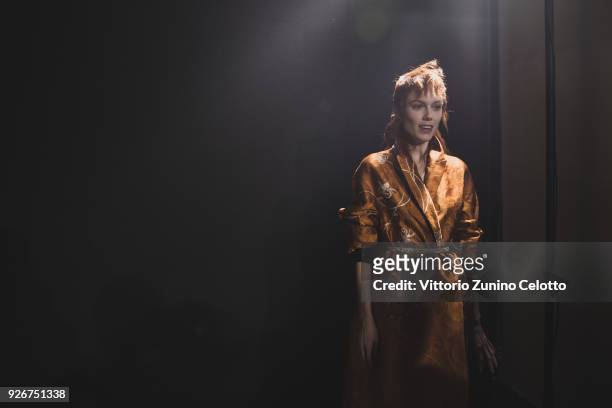 Model prepares backstage before the Haider Ackermann show as part of the Paris Fashion Week Womenswear Fall/Winter 2018/2019 on March 3, 2018 in...
