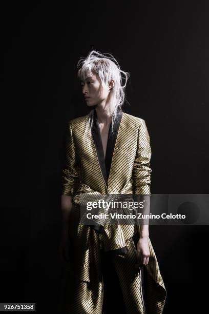 Model prepares backstage before the Haider Ackermann show as part of the Paris Fashion Week Womenswear Fall/Winter 2018/2019 on March 3, 2018 in...