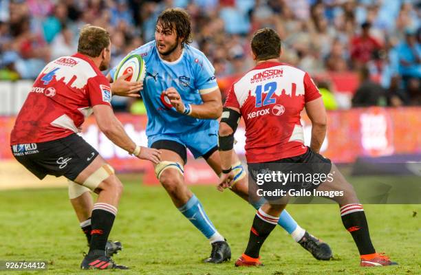 Lood de Jager of the Bulls challenged by Andries Ferreira of the Lions and Rohan Janse Van Rensburg of the Lions during the Super Rugby match between...