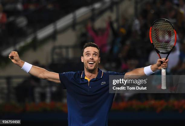 Roberto Bautista Agut of Spain celebrates winning the final match against Lucas Pouille of France on day six of the ATP Dubai Duty Free Tennis...