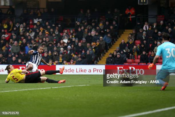 Sebastian Prodl of Watford challenges Salomon Rondon of West Bromwich Albion as he shoots at goal before Orestis Karnezis of Watford gathers his shot...