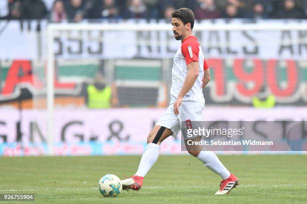 Rani Khedira of Augsburg plays the ball during the Bundesliga match between FC Augsburg and TSG 1899 Hoffenheim at WWK-Arena on March 3, 2018 in...