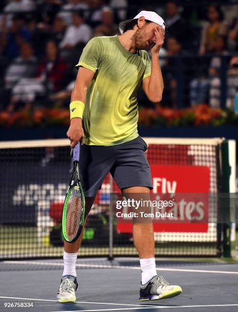 Lucas Pouille of France looks dejected during his final match against Roberto Bautista Agut of Spain on day six of the ATP Dubai Duty Free Tennis...