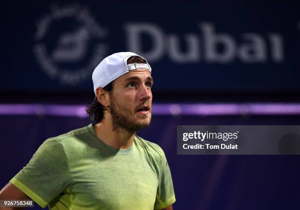 Lucas Pouille of France looks up during his final match against Roberto Bautista Agut of Spain on day six of the ATP Dubai Duty Free Tennis...