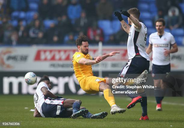 Preston North End's Greg Cunningham battles with Bolton Wanderers' Sammy Ameobi and Dorian Dervite during the Sky Bet Championship match between...