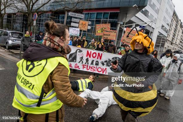 Demonstration in front of the headquarters of the Bayer company against the merger with the Monsanto company in Lyon, France, on March 3rd, 2018.