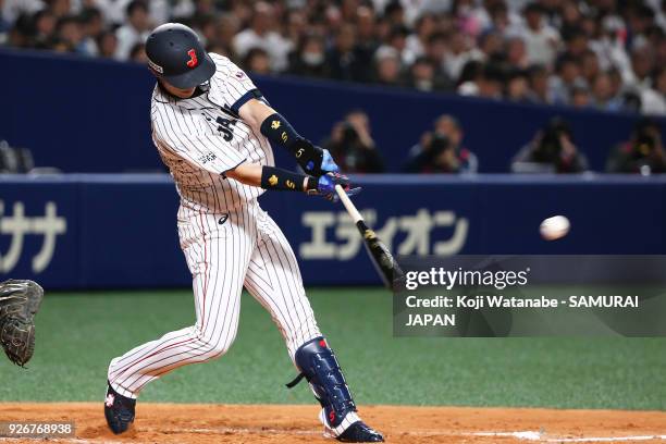 Shuta Tonosaki of Japan hits a single in the bottom half of the second inning during the game one of the baseball international match between Japan...