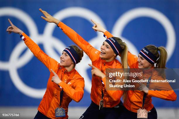 Joy Beune of the Netherlands, Jutta Leerdam of the Netherlands and Elisa Dul of the Netherlands stand on the podium after winning the women's 1000...