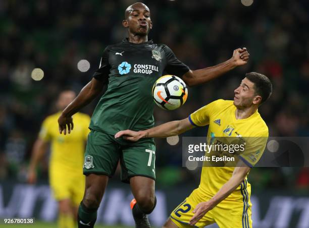 Charles Kabore of FC Krasnodar vies for the ball with Aleksei Ionov of FC Rostov Rostov-on-Don during the Russian Premier League match between FC...