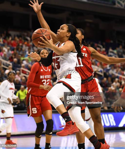 Louisville Cardinals guard Asia Durr shoots during the ACC women's tournament game between the NC State Wolfpack and the Louisville Cardinals on...