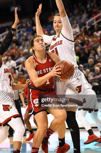 North Carolina State Wolfpack guard Aislinn Konig drives through traffic during the ACC women's tournament game between the NC State Wolfpack and the...