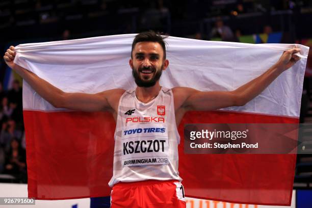 Adam Kszczot of Poland celebrates winning the 800 Metres Mens Final during the IAAF World Indoor Championships on Day Three at Arena Birmingham on...