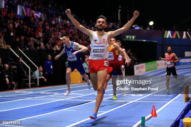 Adam Kszczot of Poland celebrates winning the 800 Metres Mens Final during the IAAF World Indoor Championships on Day Three at Arena Birmingham on...