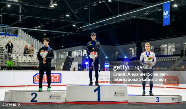 Medal ceremony with second place winning silver Kyung Hwan Hong of Korea, first place winning gold June Seo Lee of Korea and third place winning...