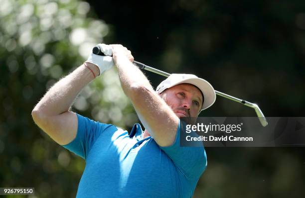 Adam Bland of Australia plays his tee shot on the par 3, third hole during the third round of the World Golf Championships-Mexico Championship at the...