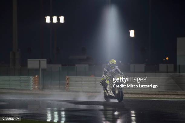 Alvaro Bautista of Spain and Angel Nieto Team heads down a straight and test the wet track during the Moto GP Testing - Qatar at Losail Circuit on...