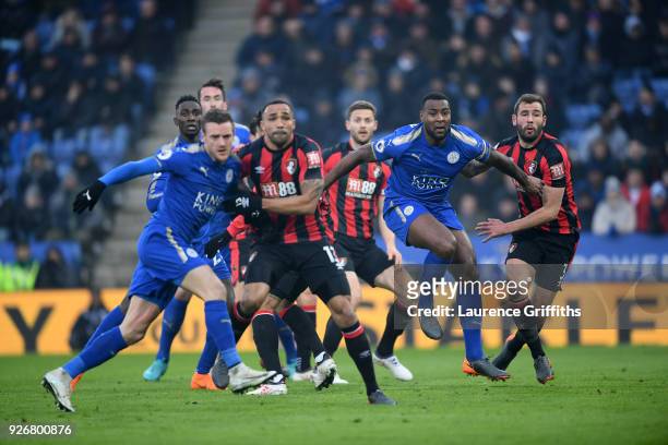 Wes Morgan of Leicester battles for position at a corner with Steve Cook of Bornemouth during the Premier League match between Leicester City and AFC...