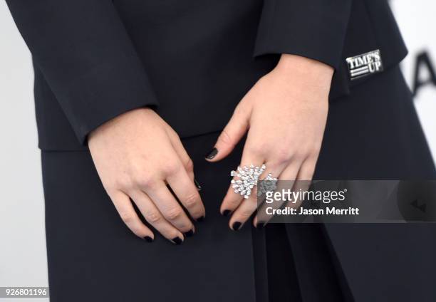 Actor Zoey Deutch, jewelry detail, attends the 2018 Film Independent Spirit Awards on March 3, 2018 in Santa Monica, California.