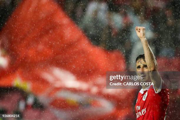 Benfica's Brazilian forward Jonas celebrates a goal during the Portuguese league football match between SL Benfica and CS Maritimo at the Luz stadium...