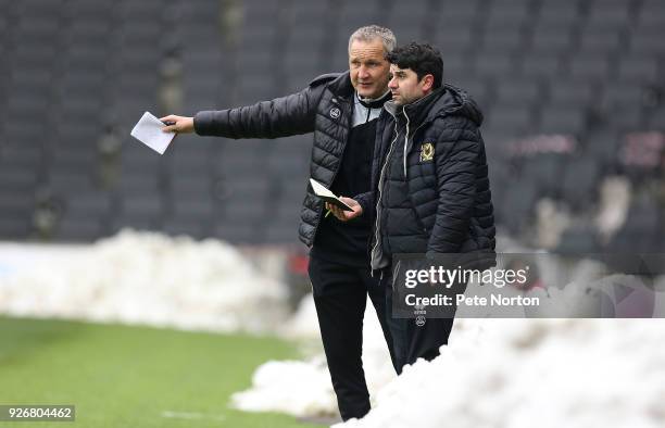 Milton Keynes Dons assistant manager Keith Millen makes a point to manager Dan Micciche during the Sky Bet League One match between Milton Keynes...