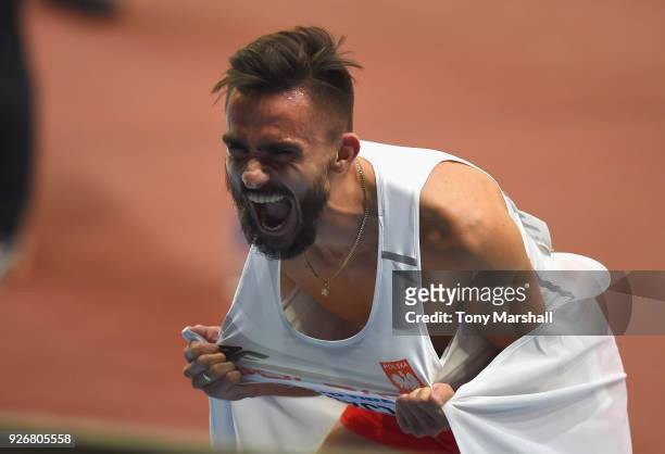 Adam Kszczot of Poland celebrates winning the Men's 800m Final during Day Three of the IAAF World Indoor Championships at Arena Birmingham on March...