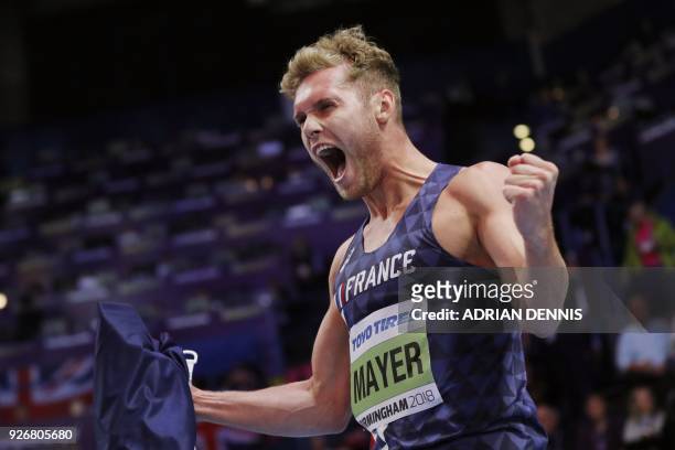 France's Kevin Mayer celebrates taking gold in the men's heptathlon event at the 2018 IAAF World Indoor Athletics Championships at the Arena in...