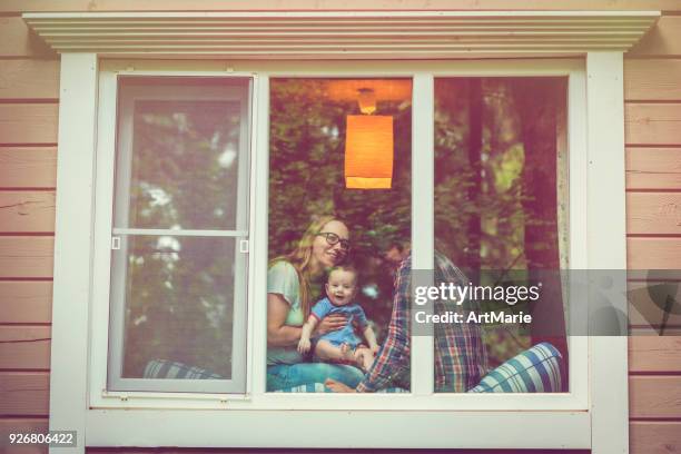 family looking out of the window - looking at view stock pictures, royalty-free photos & images