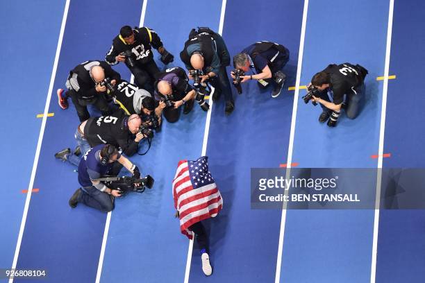 Athlete Will Claye celebrates taking gold in the men's triple jump final at the 2018 IAAF World Indoor Athletics Championships at the Arena in...