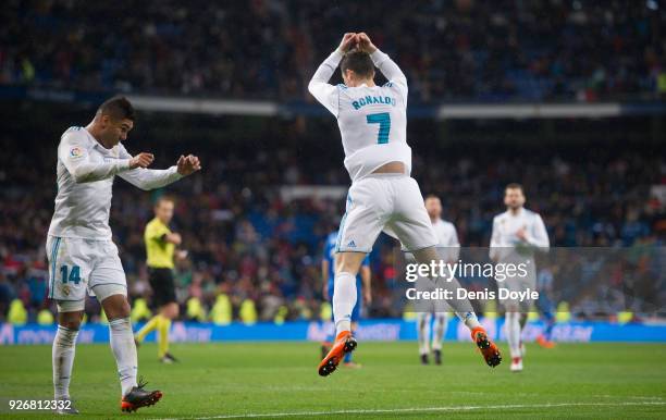 Cristiano Ronaldo of Real Madrid celebrates after scoring his team's second goal during the La Liga match between Real Madrid and Getafe at Estadio...