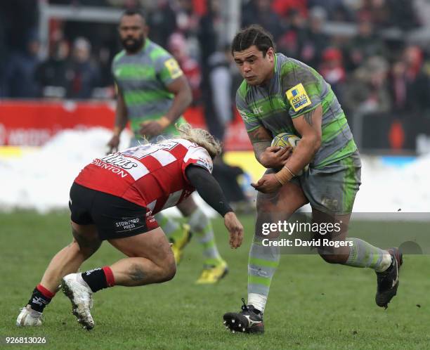 Sam Lockwood of Newcastle takes on Richard Hibbard during the Aviva Premiership match between Gloucester Rugby and Newcastle Falcons at Kingsholm...