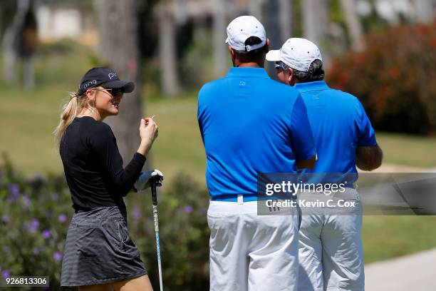 Golfer Amanda Blumenherst speaks with fans on the 16th hole during the second day of the Puerto Rico Open Charity Pro-Am at TPC Dorado Beach on March...