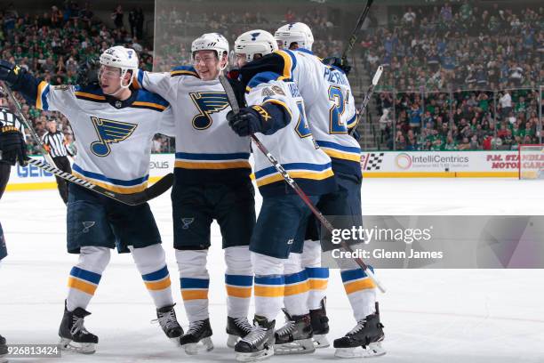 Vince Dunn, Vladimir Tarasenko, Ivan Barbashev and the St. Louis Blues celebrate a goal against the Dallas Stars at the American Airlines Center on...