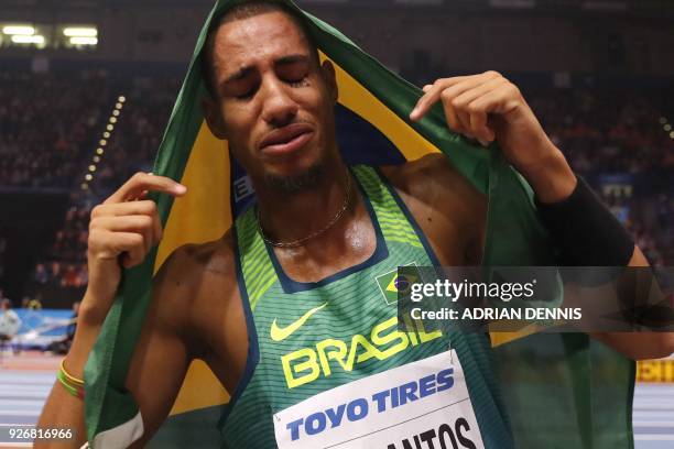 Brazil's Almir dos Santos celebrates taking silver in the men's triple jump final at the 2018 IAAF World Indoor Athletics Championships at the Arena...