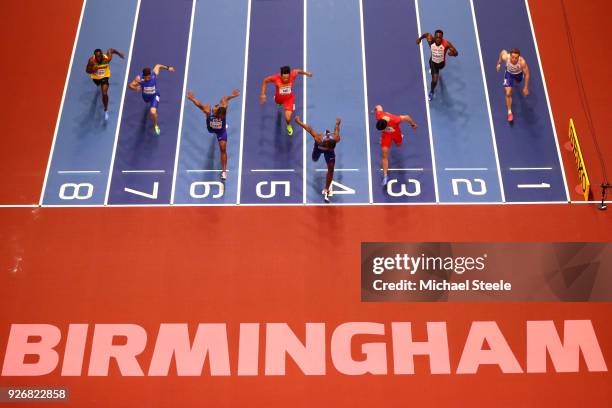 Christian Coleman of United States dips to beat Bingtian Su of China in the 60 Meters Mens Final during the IAAF World Indoor Championships on Day...