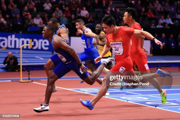 Christian Coleman of United States dips to beat Bingtian Su of China in the 60 Meters Mens Final during the IAAF World Indoor Championships on Day...