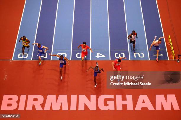 Christian Coleman of United States dips to beat Bingtian Su of China in the 60 Meters Mens Final during the IAAF World Indoor Championships on Day...