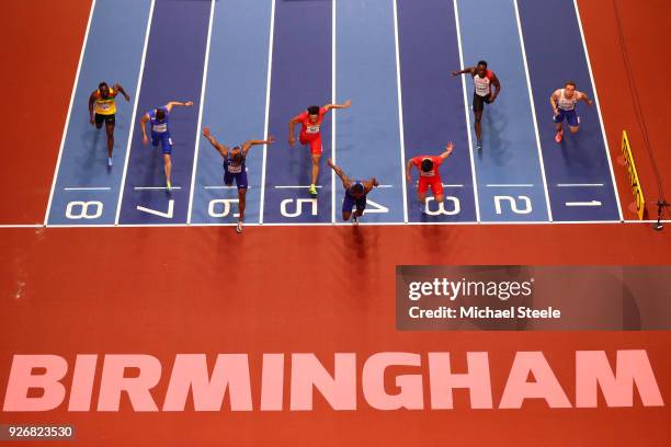 Christian Coleman of United States dips to beat Bingtian Su of China in the 60 Meters Mens Final during the IAAF World Indoor Championships on Day...