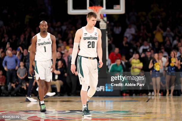 Matt McQuaid and Joshua Langford of the Michigan State Spartans react following their 75-64 loss to the Michigan Wolverines during semifinals of the...