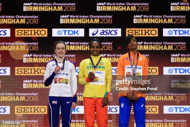 Gold Medallist, Genzebe Dibaba of Ethopia, Silver Medallist, Sifan Hassan of Netherlands and Bronze Medallist, Laura Muir of Great Britain celebrate...