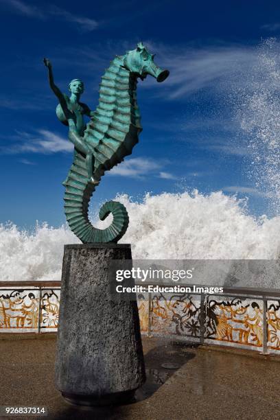 Boy on a Seahorse on Puerto Vallarta Malecon with splash of ocean wave.